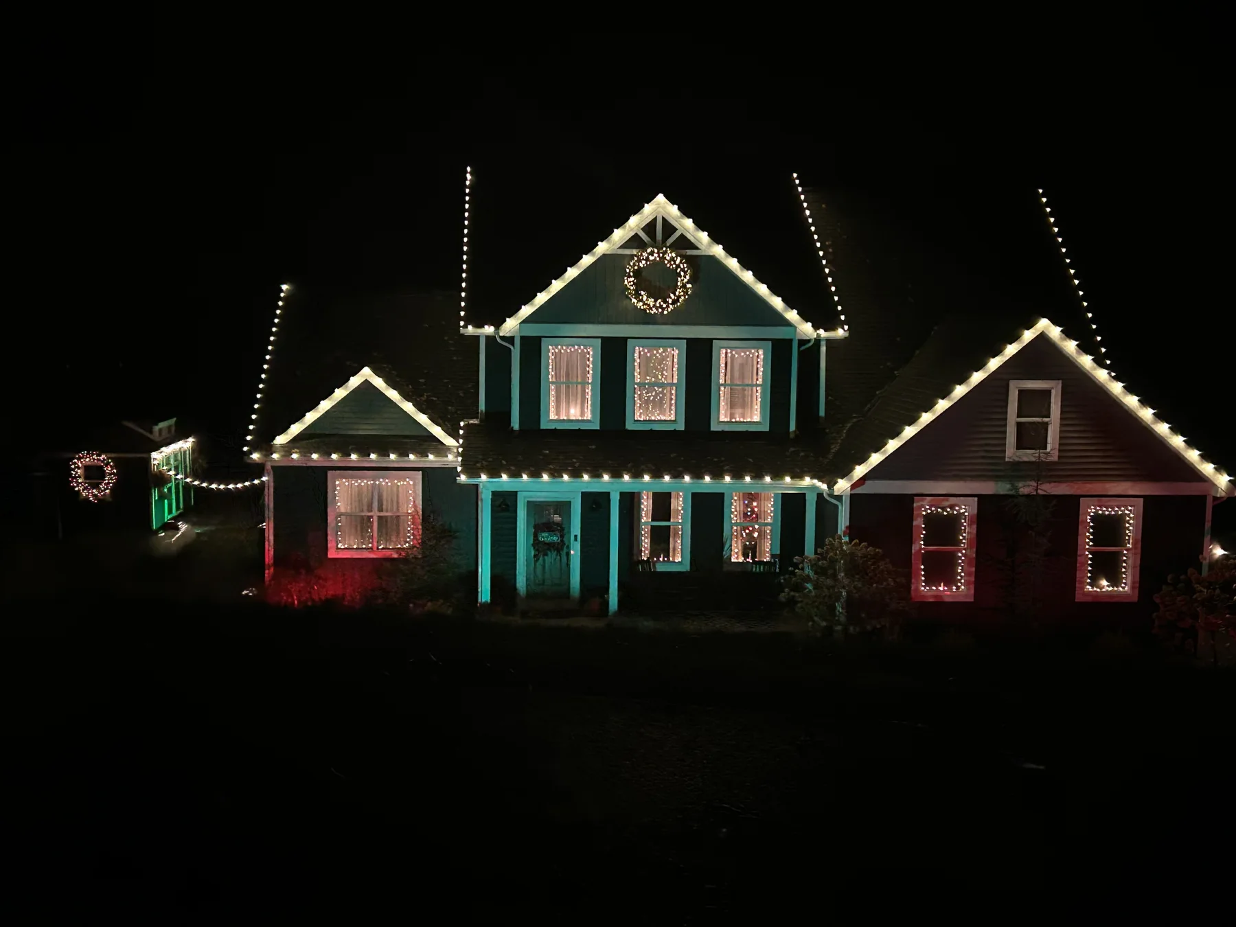 Warm white Christmas lights with red and green window accents